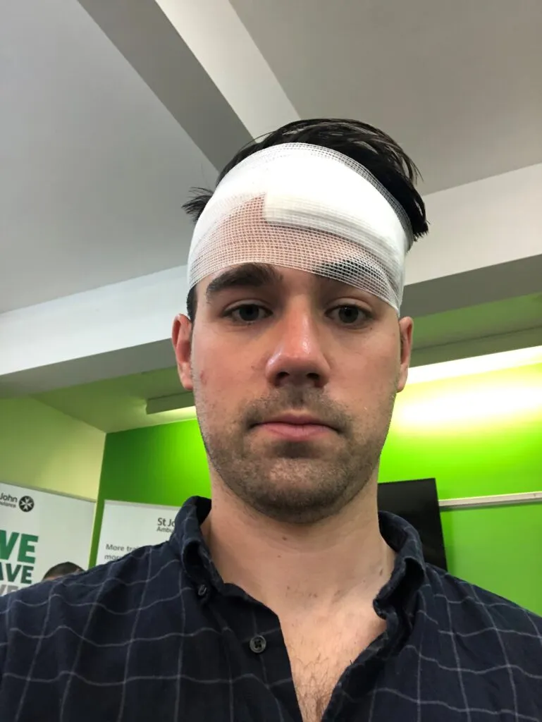 A man with a bandage around his head.